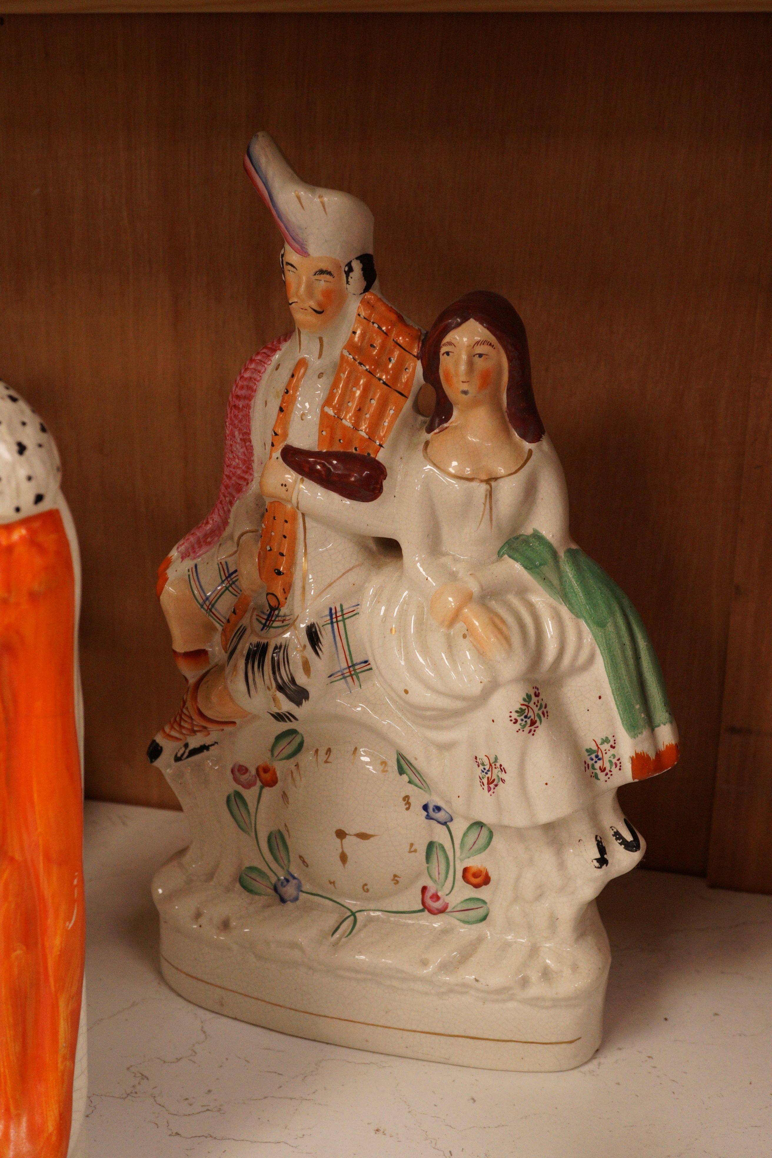 A group of Staffordshire pottery groups, tallest 38cm
